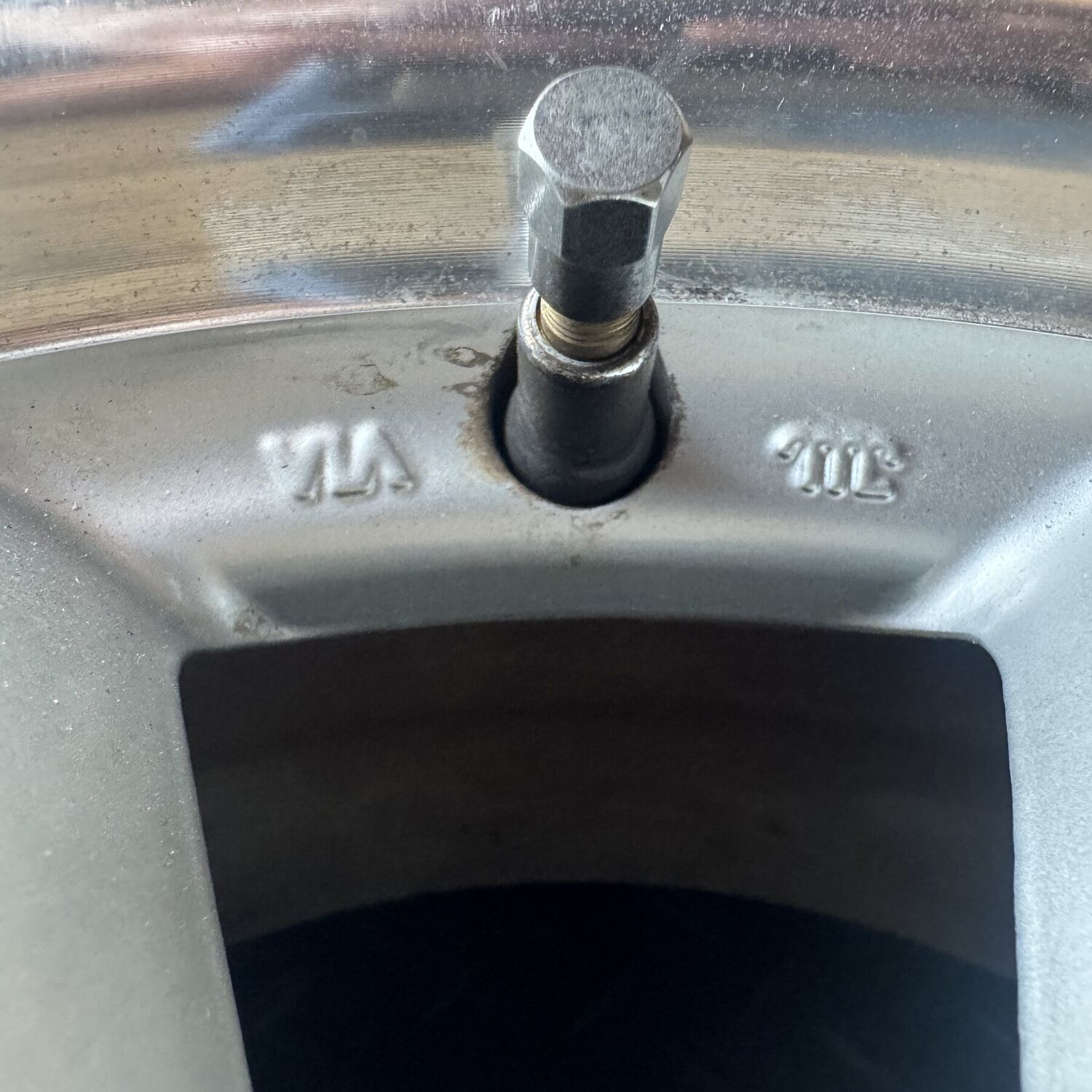 VIA and JWL marks cast either side of the valve hole on the wheel face