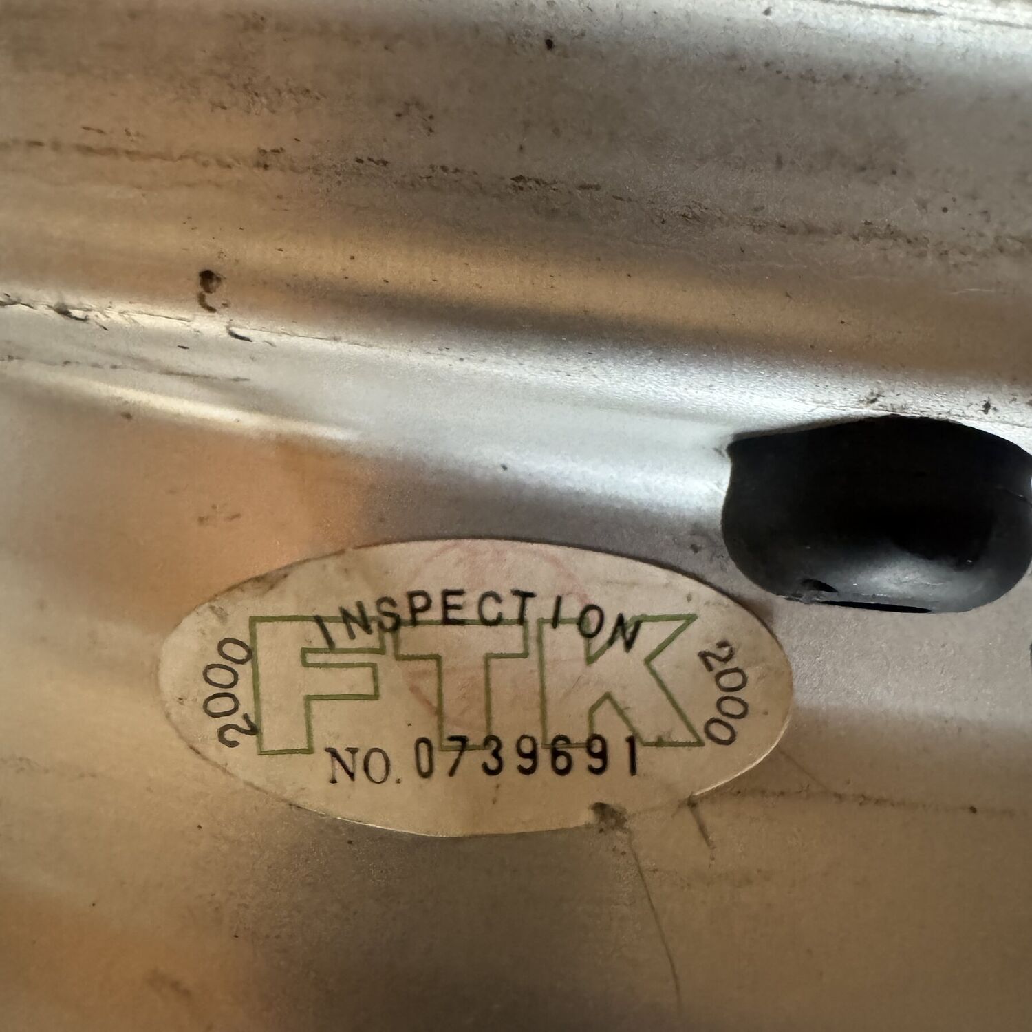 FTK inspection sticker number 0739691 dated 2000 inside the rim well