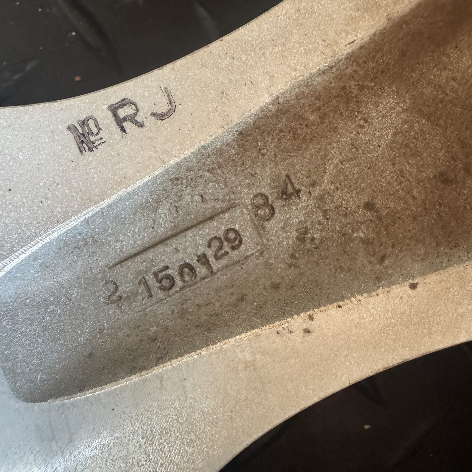 Serial number RJ 2 150129 84 cast into the back of a WORK Meister S1R spoke