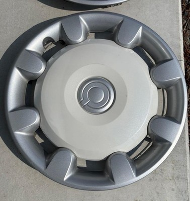 JDM Daihatsu canvas wheel caps 4 pieces no cracks. (No Tires)