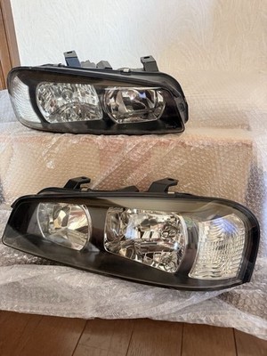 JDM Nissan Skyline R34 headlights left and right genuine halogen type. (No Tires)