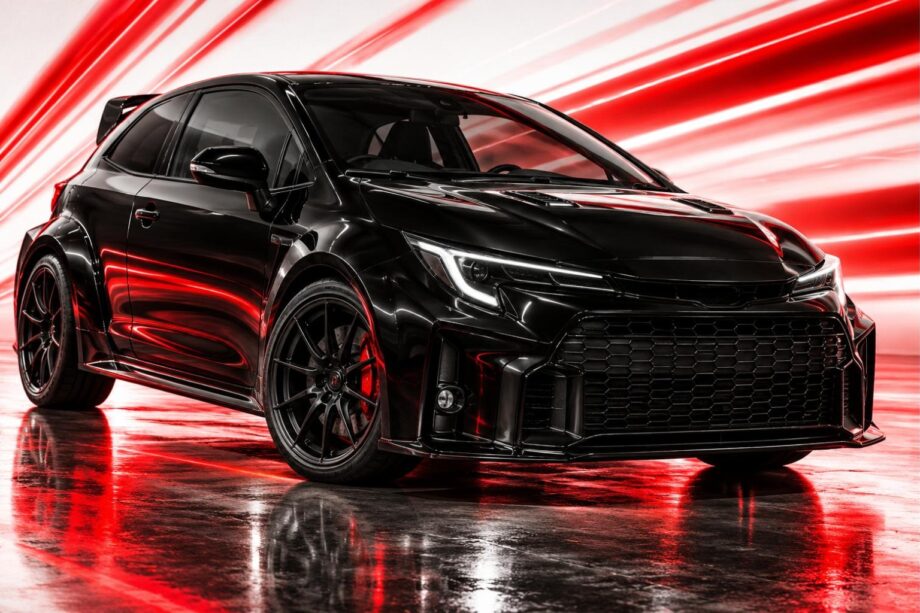 Black Toyota GR Corolla in a studio with red light streaks